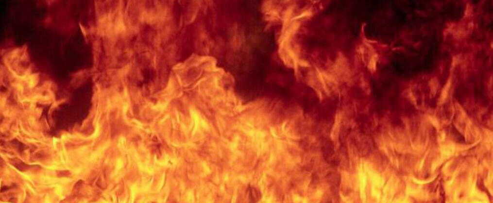 A photo of a red and orage fire against a black background.