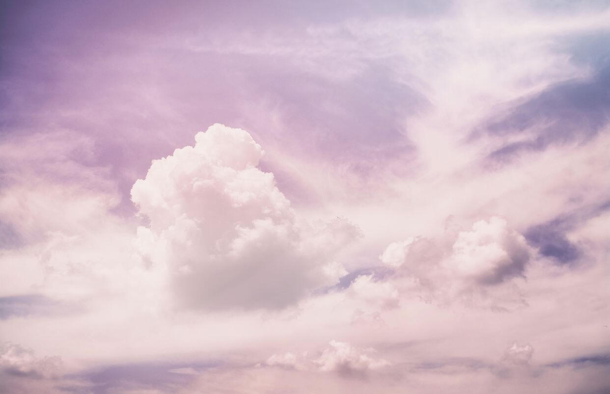 A cloudscape of light purple clouds.